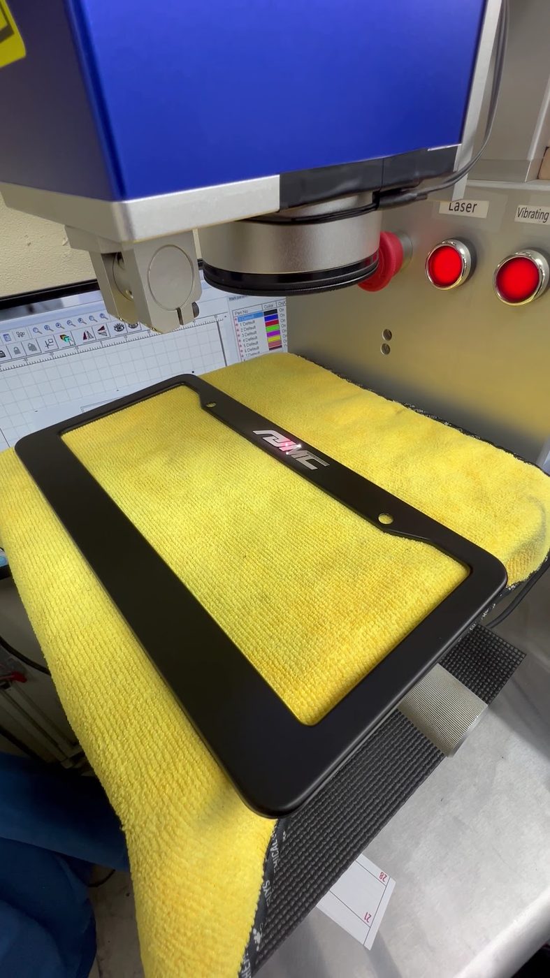 An engraving machine set up with a workpiece clamped in place
