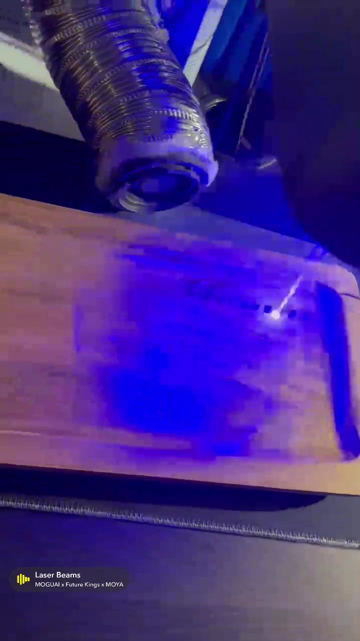 Close up of the laser engraver cutting into a metal surface