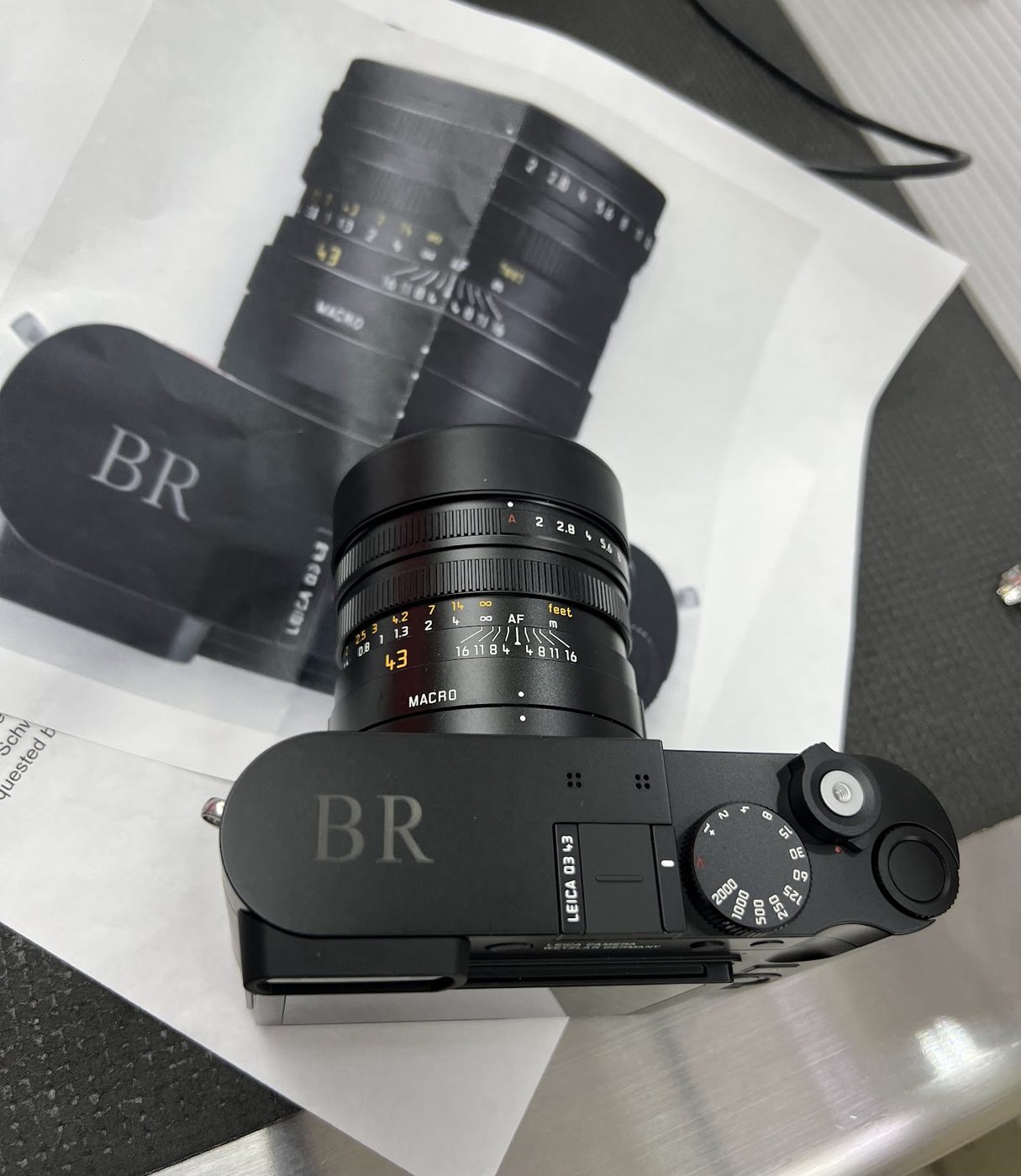 Black Leica camera body engraved with initials