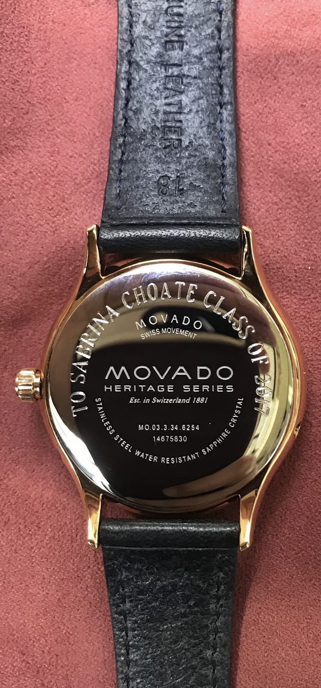 Movado wristwatch with an engraved message around the case back