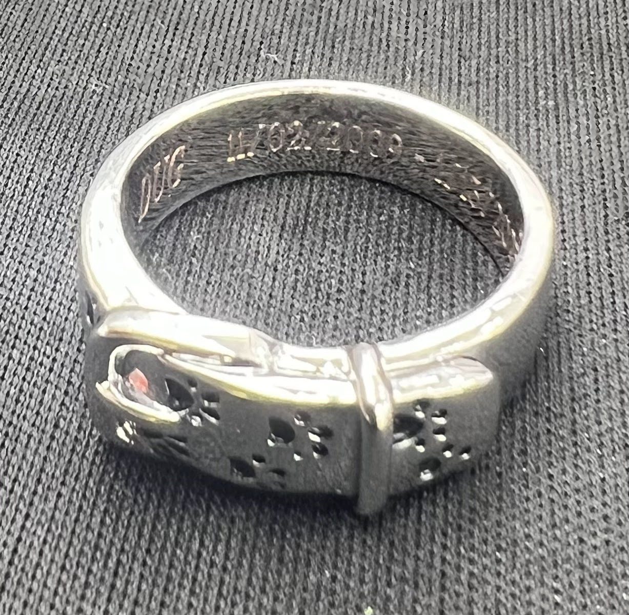 Wide silver cuff bracelet with an all-over engraved pattern