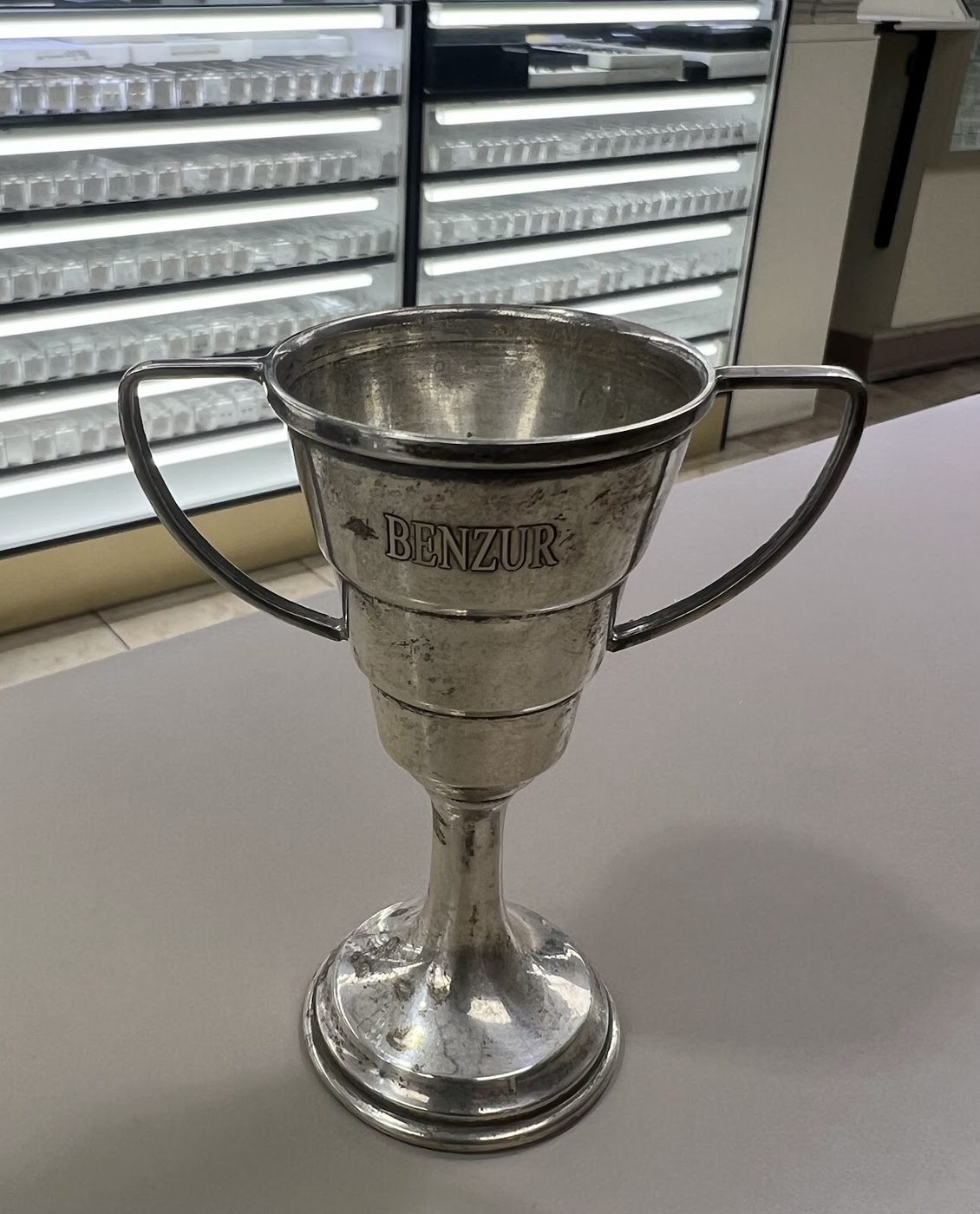 Small silver presentation trophy cup engraved with an inscription