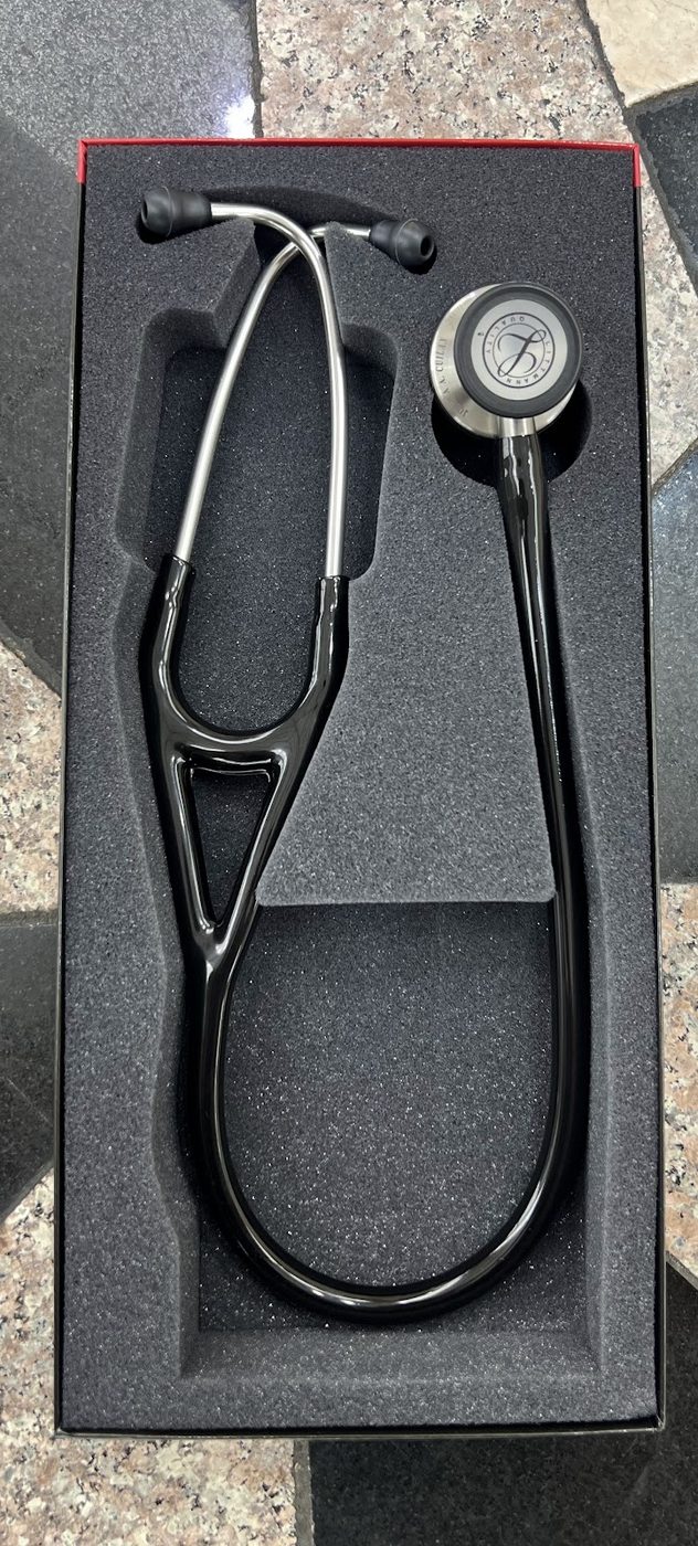 A black Littmann stethoscope engraved and presented in its box