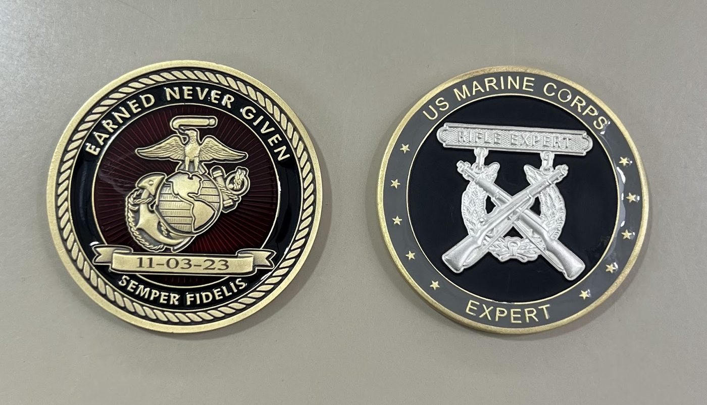 Two engraved United States Marine Corps challenge coins