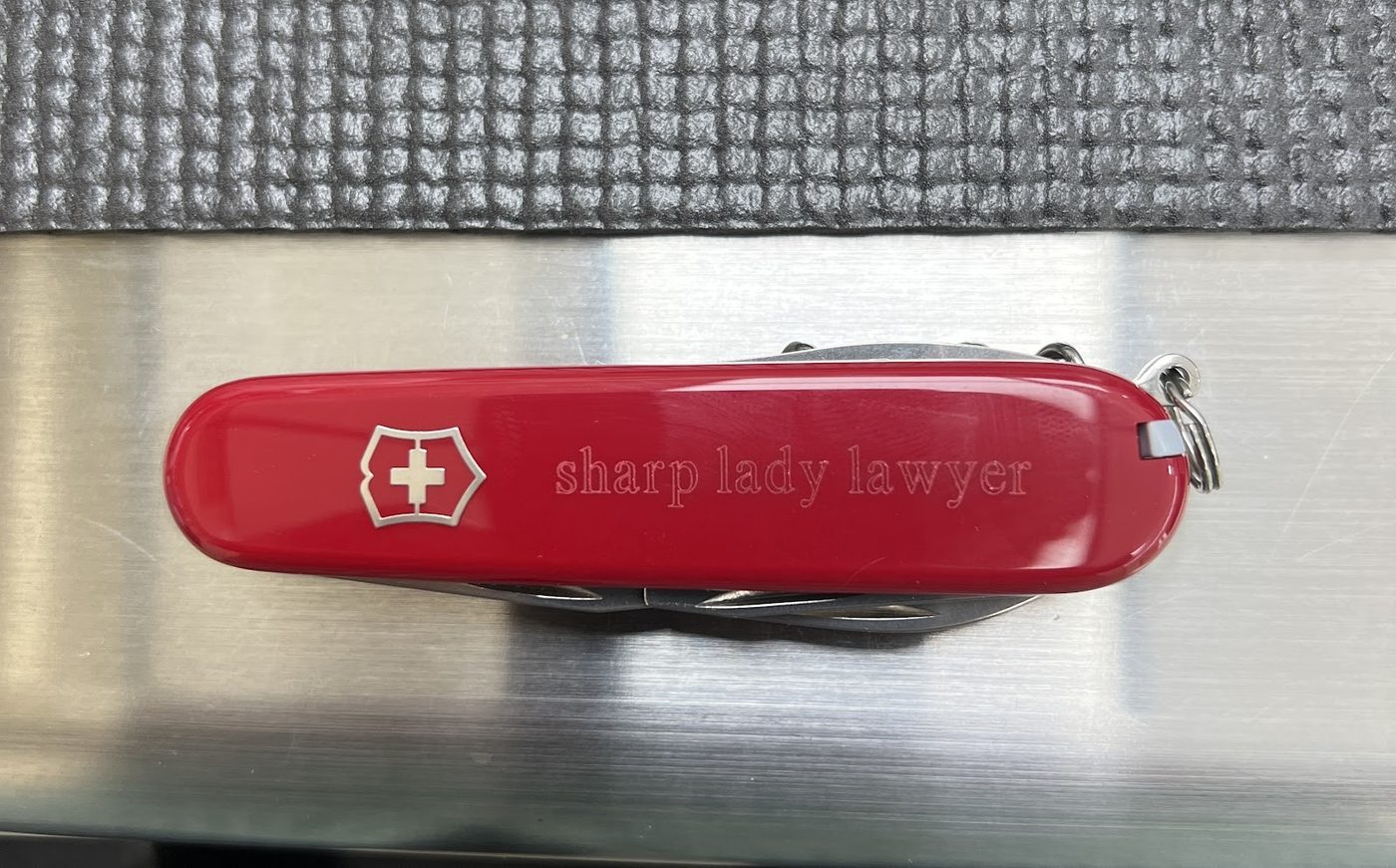 Red Swiss Army knife engraved along the casing