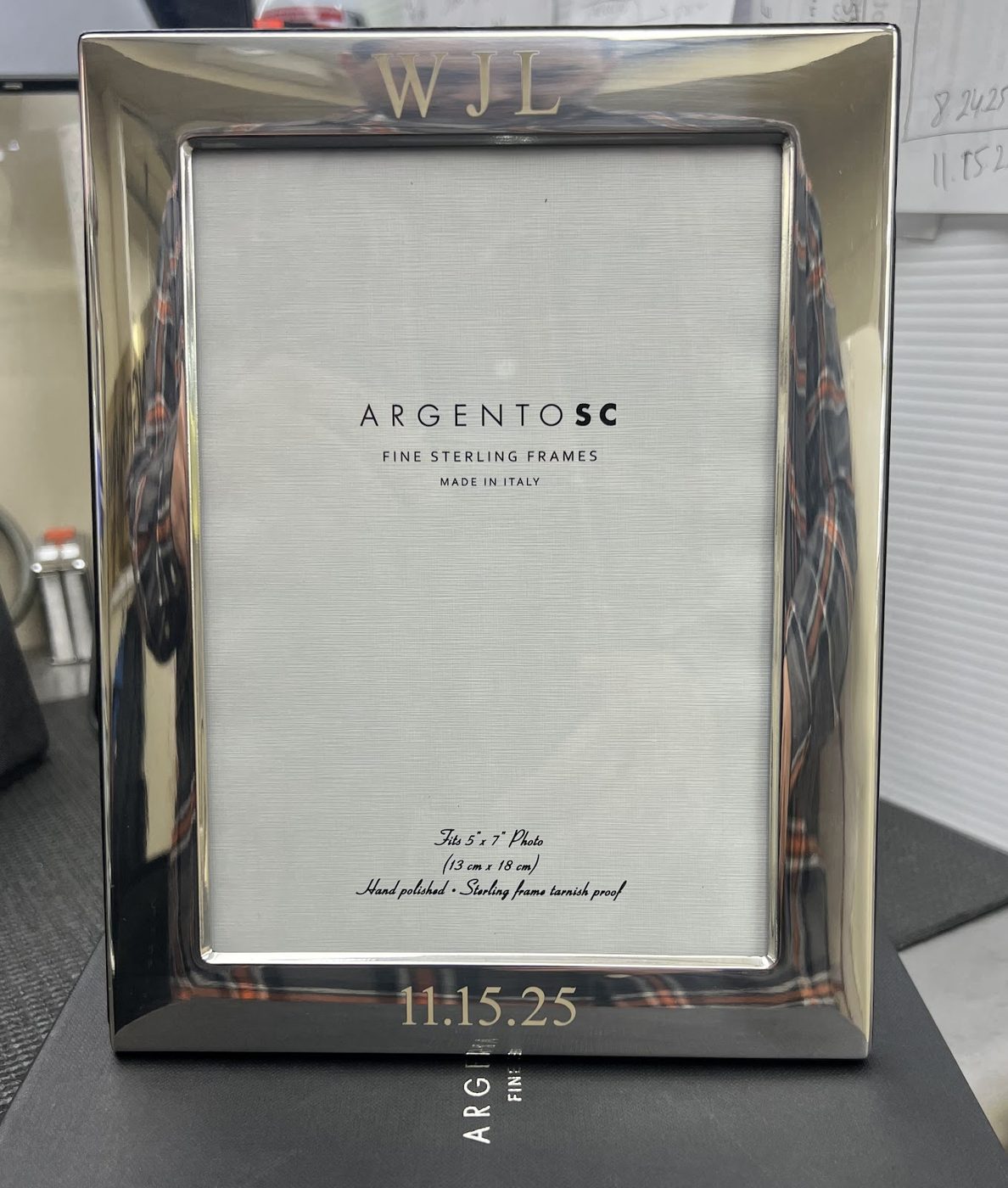 Silver photo frame engraved with initials and a wedding date